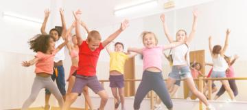 Boys and girls jumping in dance studio